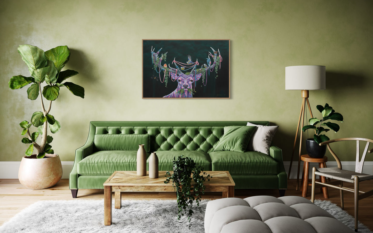 Cozy living room featuring a green couch and a serene painting titled '(Un)seen Energy' by Glenn Verkerk, depicting a multicolored deer with birds and greenery in its antlers.