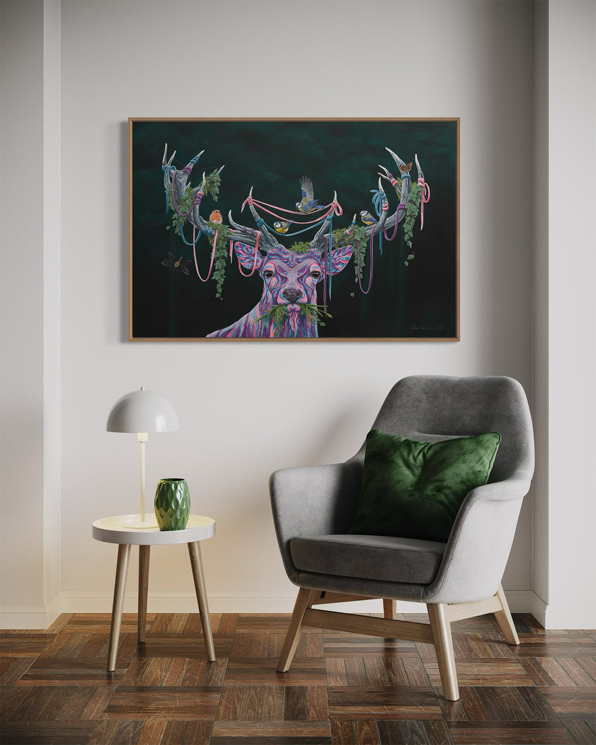 Cozy modern seating with a small designer table and a serene acrylic painting '(Un)seen Energy' by Glenn Verkerk in a wooden frame, depicting a multicolored deer with birds and greenery in its antlers.