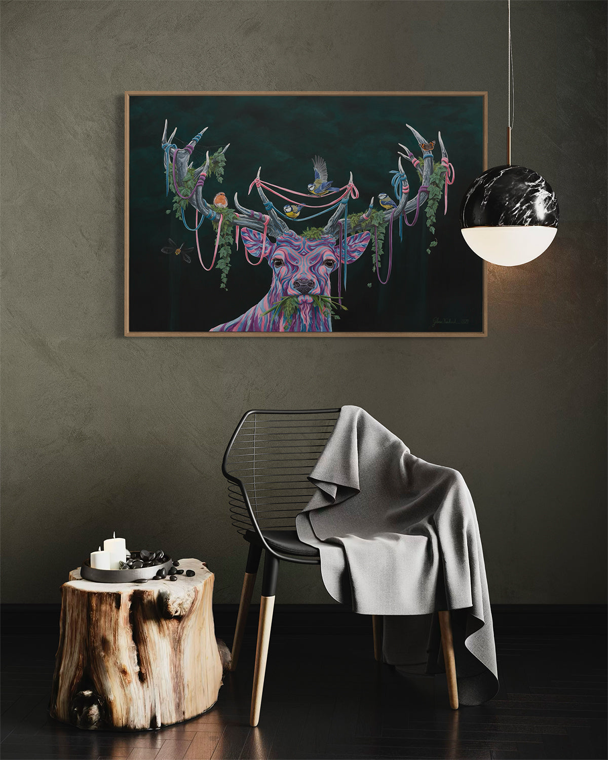 Cozy modern seating with a small wooden table and a serene acrylic painting '(Un)seen Energy' by Glenn Verkerk, featuring a multicolored deer with birds and greenery in its antlers.