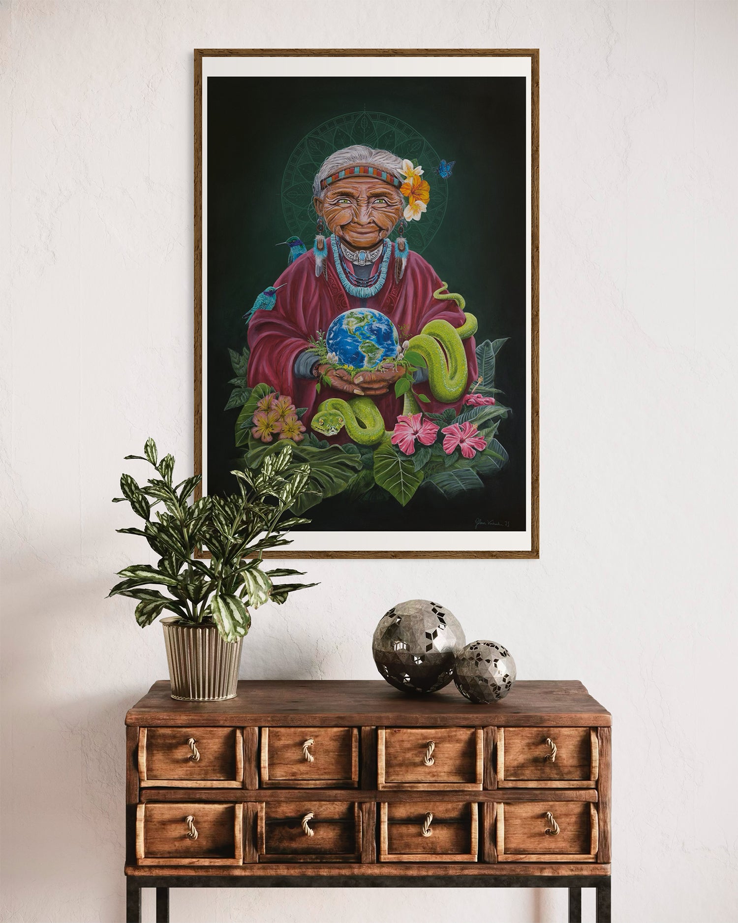 Tranquil designer decor featuring a print of the artwork titled 'Pachamama' by Glenn Verkerk, which depicts an imaginative version of Mother Earth holding planet Earth. The artwork, inspired by Inca tribe traditions and symbolism, is surrounded by a mandala, animals, and lush green elements.